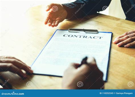 Business People Negotiating a Contract between Two Colleagues Stock ...