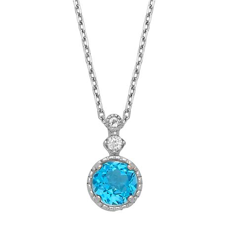 Silver Pendant With A Round Swiss Blue Topaz Center And White Topaz Accents