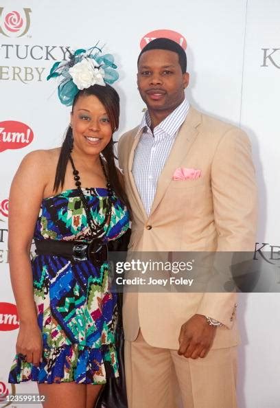 Nfl Player Kerry Rhodes Of The Arizona Cardinals And Guest Attend The