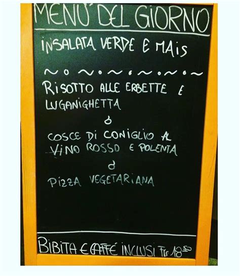 The Menu For An Italian Restaurant Is Written On A Blackboard With