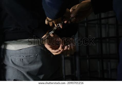 Police Officer Handcuffs Suspect Stock Photo 2090701216 | Shutterstock