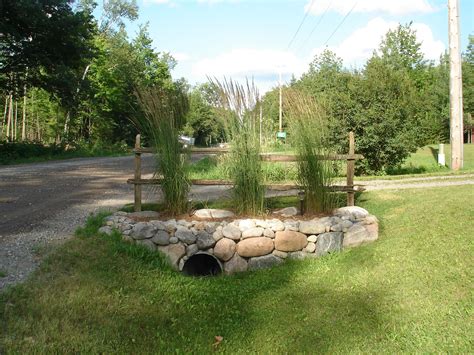 Curb appeal over culvert three. | Driveway entrance landscaping ...