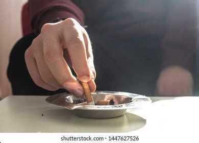 Hand Stubbing Out Cigarette Photos And Images Shutterstock