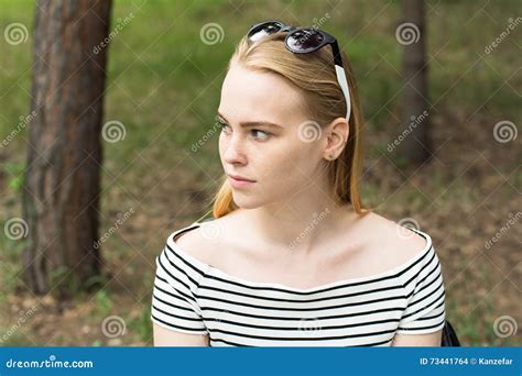 Portrait Of A Pensive Young Woman Looking Away Stock Photo Image Of