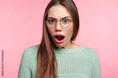 Astonished Female Brunette Student Opens Mouth Widely As Find Ou About Putting Forward Exam On