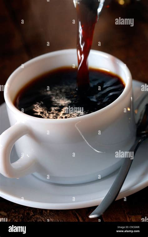 Hot Coffee Pouring Into Cup Stock Photo Alamy