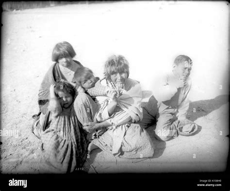 Apache Indian Grandmother Carrying Her Grandchild On Her Back And Three