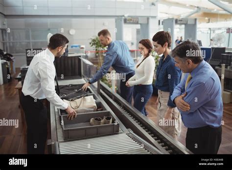 Passengers in airport security check Stock Photo - Alamy