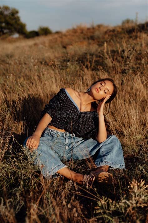 Fashionable Young Model In Boho Style Clothes On A Background Of Dry