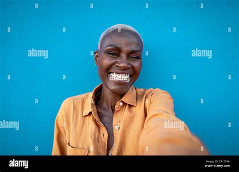 Happy African Woman Having Fun Taking Selfie With Smartphone Camera