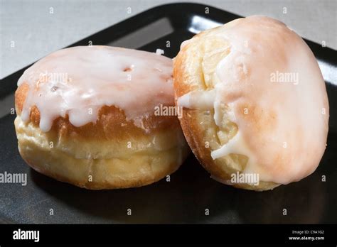 Jam Donuts / iced buns Stock Photo - Alamy