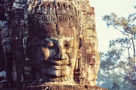 Premium Photo Stone Faces Of Ancient Khmer Culture Temple Of Bayon In