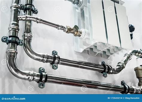 Wiring Of Radiator Pipes In The Room On The Wall Stock Photo Image Of
