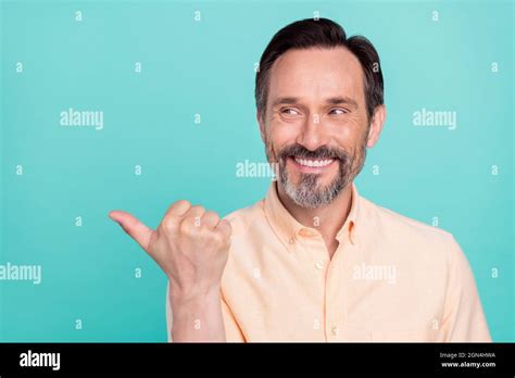 Photo Of Cheerful Attractive Mature Man Look Copyspace Advertising