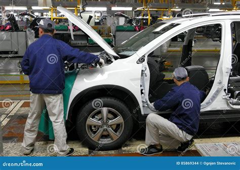 Workers Assemble A Car On Assembly Line In Car Factory Editorial Stock