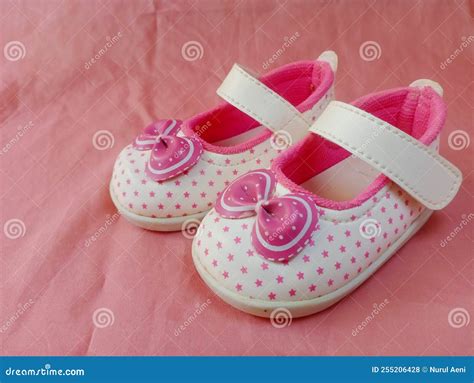 Cute Pink Baby Shoes For Little Girl On Pink Background Stock Photo