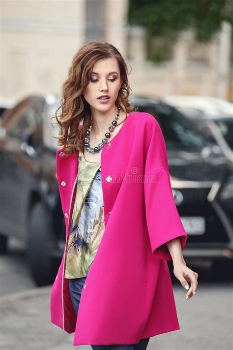 Slim Beautiful Girl Dressed In A Stylish Summer Fuchsia Corol Coat