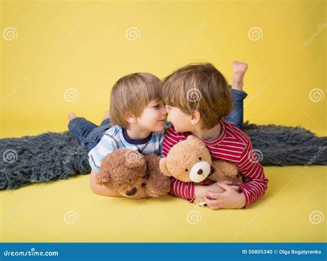 Happy Kids Siblings Hugging Stuffed Toys Stock Photo Image Of