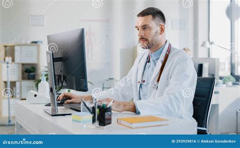 Hospital Medical Doctor Office: Portrait of Smiling Professional Physician Working on Desktop ...