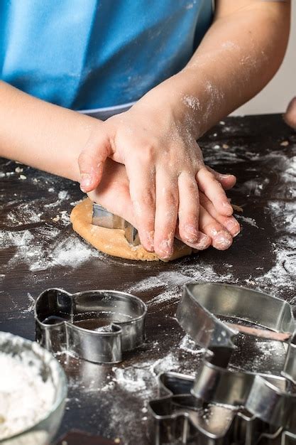 Premium Photo | Cutting dough on different shapes. christmas gingerbread.