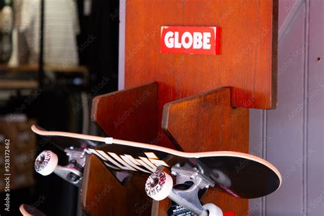 globe logo sign and brand text on display skate board store facade clothing shop entrance Stock ...