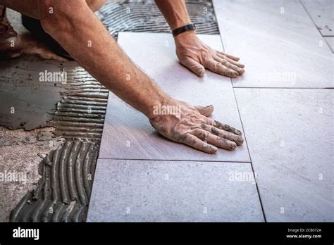 Tile Installation With Glue On Concrete Floor Stock Photo Alamy