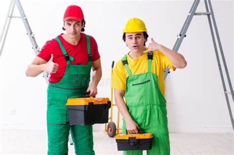 Two Workers Contractors Working Indoors Stock Image Image Of Plank