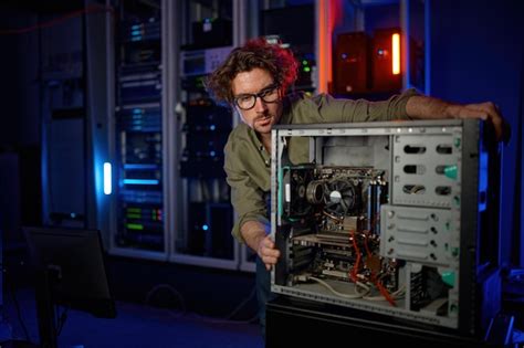 Premium Photo Repairman Working With Computer System Unit At Pc