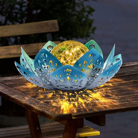 A Blue And White Decorative Bowl Sitting On Top Of A Wooden Table Next