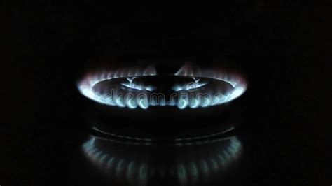 Gas Stove Burning In The Kitchen Blue Flames Black Background Stock