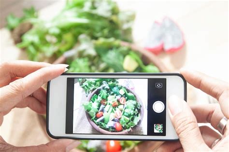 Premium Photo Cropped Hands Of Woman Photographing Salad In Bowl