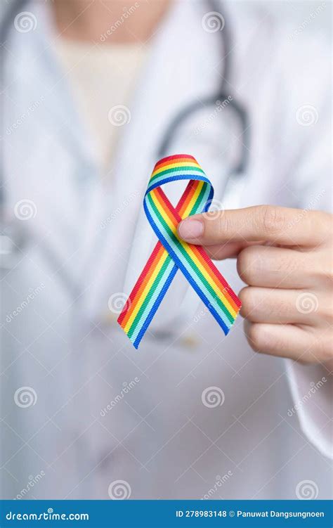 Doctor With LGBTQ Rainbow Ribbon For Support Lesbian Gay Bisexual Transgender And Community