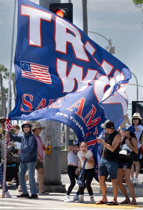 100 Trump Supporters Rally At The Huntington Beach Pier A Day After Pennsylvania Shooting