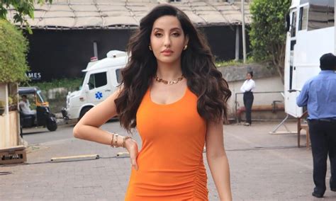 Nora Fatehi Red Deep Neck Body Fit Thigh High Slit Dress Look Bold