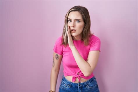 Premium Photo Blonde Caucasian Woman Standing Over Pink Background