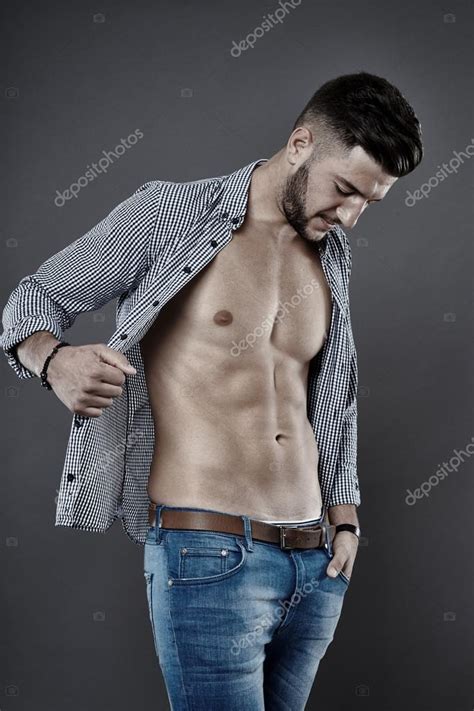 Man with unbuttoned shirt — Stock Photo © Xalanx #57213841