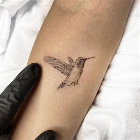 Fine Line Hummingbird Tattoo On The Inner Forearm