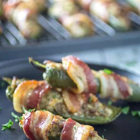 Bacon Wrapped Sausage Stuffed Jalapenos • Dishing Delish