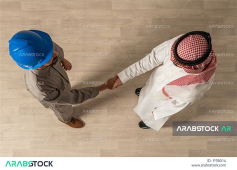 Shaking Hands Inside The Company A Vertical Overhead Photo Of Two