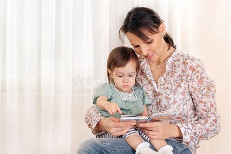 Mother Sits And Reads His Daughter Stock Image Image Of Pretty Rest