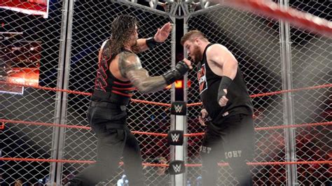 WWE Raw Roman Reigns Beat Kevin Owens Inside A Steel Cage WWE News