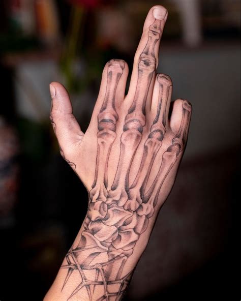 10 Stunning Skeleton Hand Tattoos Youll Love 3 Skeleton Hand Tattoo