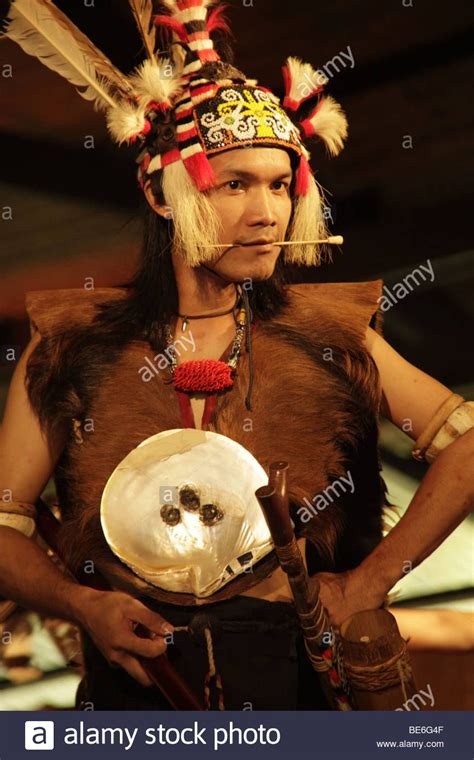 Iban Warrior With Blowpipe In The Sarawak Cultural Village Near