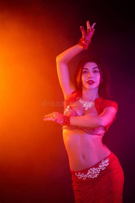 Tempting Traditional Oriental Belly Dancer Girl Dancing On Purple Neon