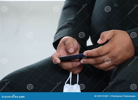 Close Up Of Focus On Male Businessman X S Hand Holding Smartphone