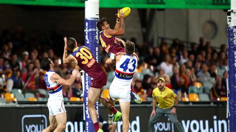 AFL round 11: Callum Ah Chee snares hanger during Brisbane Lions ...