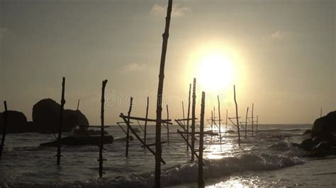 Iconic Stilt Fishing In Asia Traditional Fishing Sunset Waves