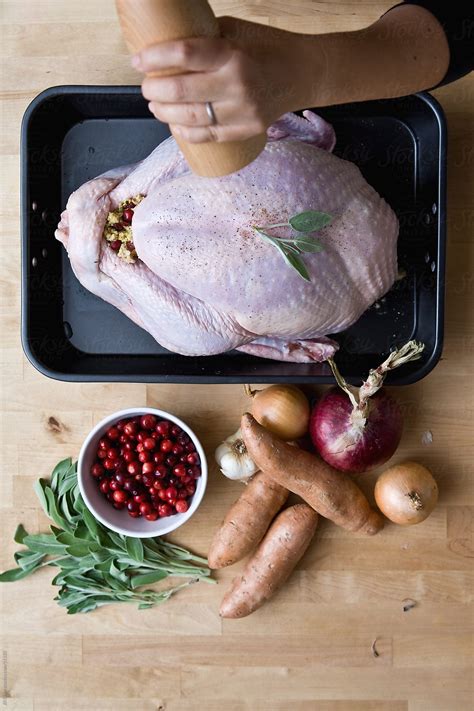 Preparing Turkey By Stocksy Contributor Jill Chen Stocksy