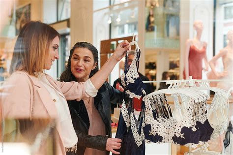 Smiling Friends Shopping For Lingerie By Stocksy Contributor Ivan Gener Stocksy