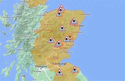 Heavy rain brings power cuts and flooding chaos with 29 red warnings ...